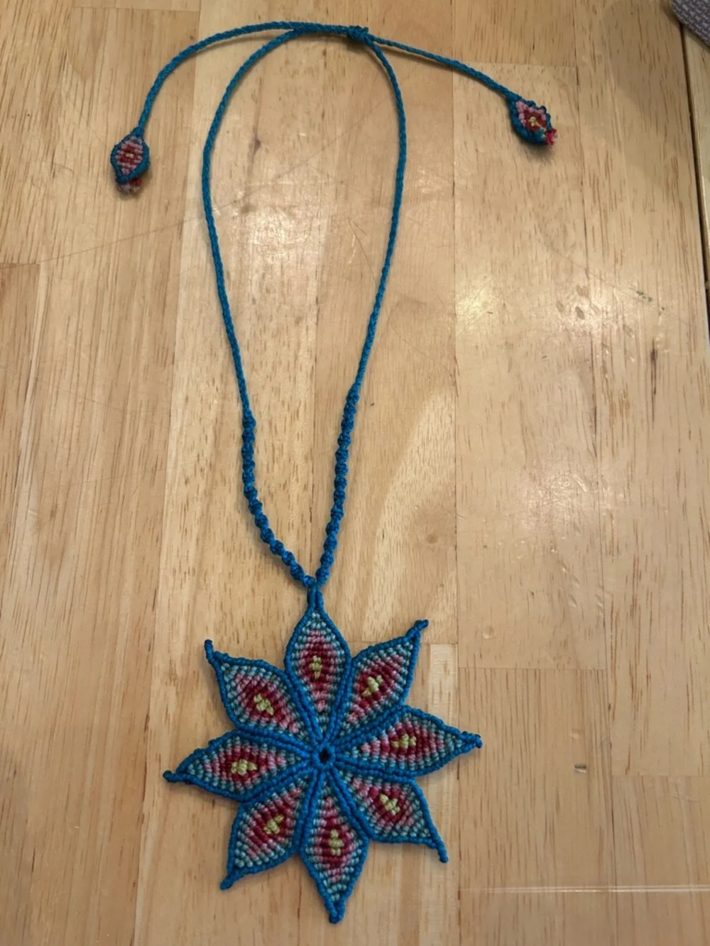 Handmade Rich Blue Macrame Flower Necklace with Red and Yellow Accents - Picture 3 of 6